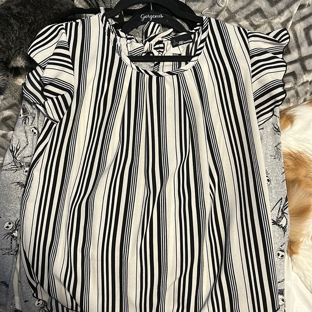 This is a black and white striped top/ blouse